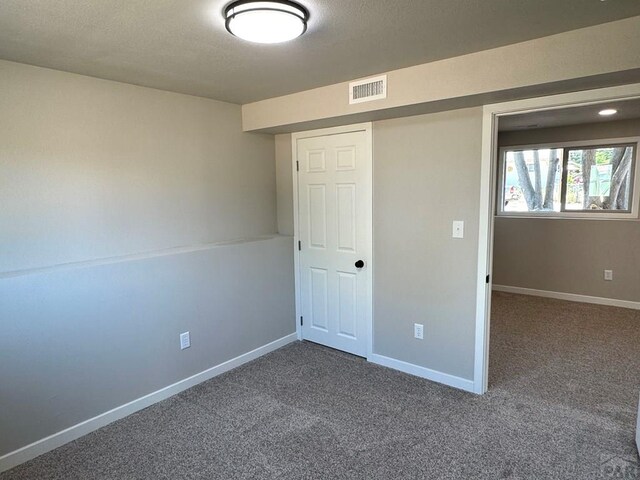 3923 Lancaster Dr, Pueblo, CO 81005 - unfurnished bedroom featuring carpet and a textured ceiling
