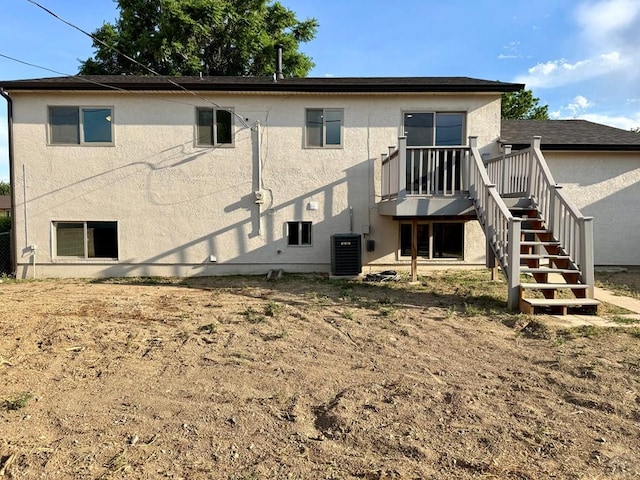 3923 Lancaster Dr, Pueblo, CO 81005 - back of property featuring stucco siding and stairway