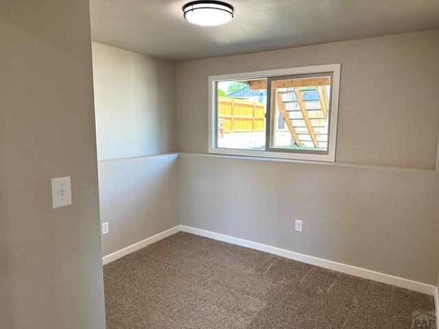 3923 Lancaster Dr, Pueblo, CO 81005 - carpeted empty room featuring baseboards