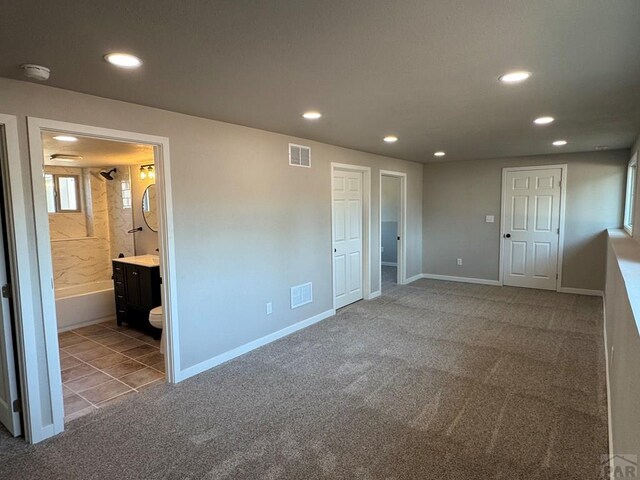 3923 Lancaster Dr, Pueblo, CO 81005 - unfurnished bedroom featuring recessed lighting, carpet, and ensuite bathroom