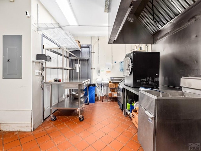 kitchen featuring electric panel and tile patterned floors