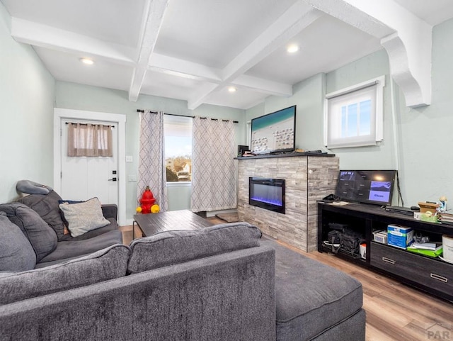 living room featuring coffered ceiling, wood finished floors, a fireplace, beam ceiling, and recessed lighting