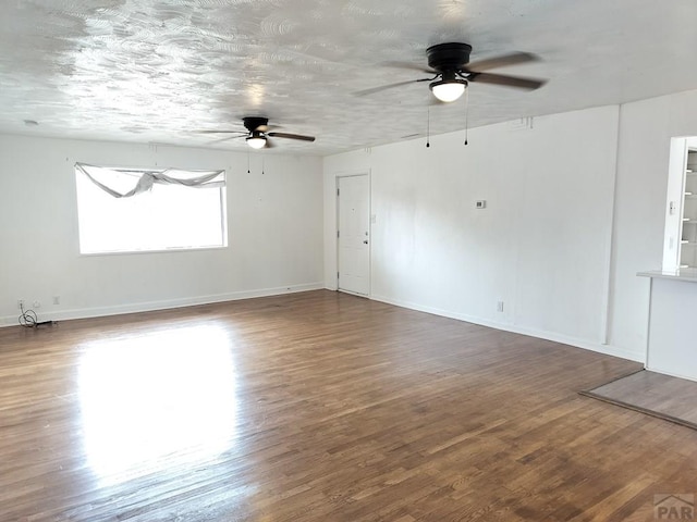1143 25th Ln, Pueblo, CO 81006 - spare room featuring ceiling fan, wood finished floors, and baseboards