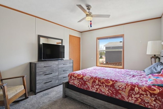 bedroom with crown molding, a ceiling fan, and carpet flooring