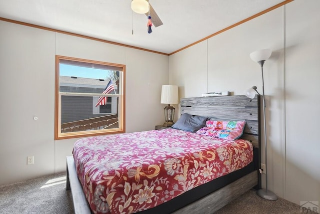 bedroom with ornamental molding, carpet, and a ceiling fan