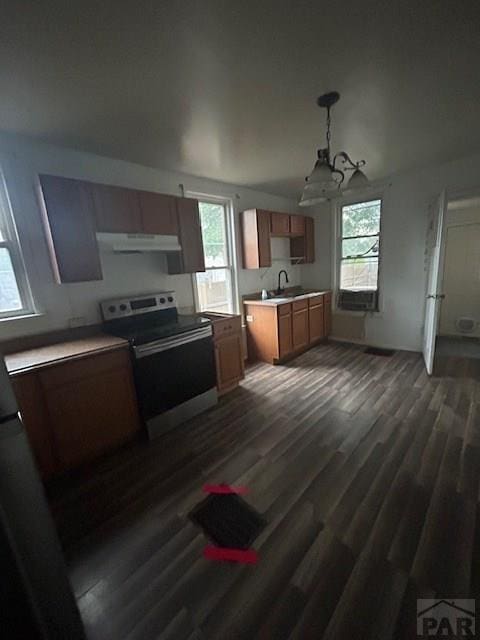 1045 Berkley Ave, Pueblo, CO 81004 - kitchen featuring stainless steel range with electric cooktop, a chandelier, plenty of natural light, and under cabinet range hood