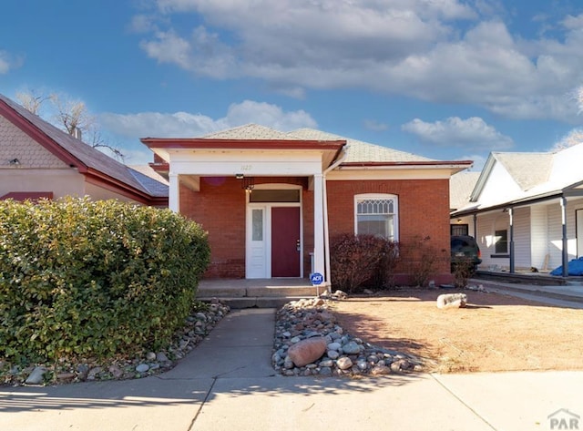 view of front of property with brick siding