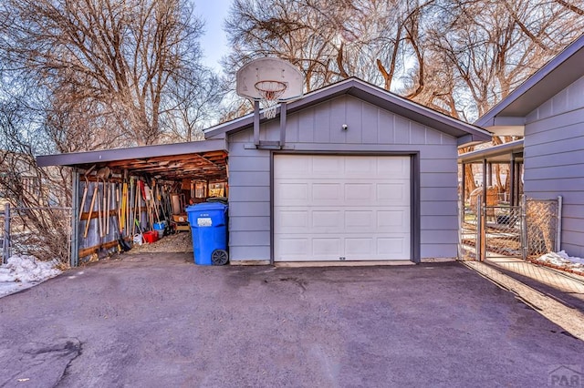 detached garage featuring driveway