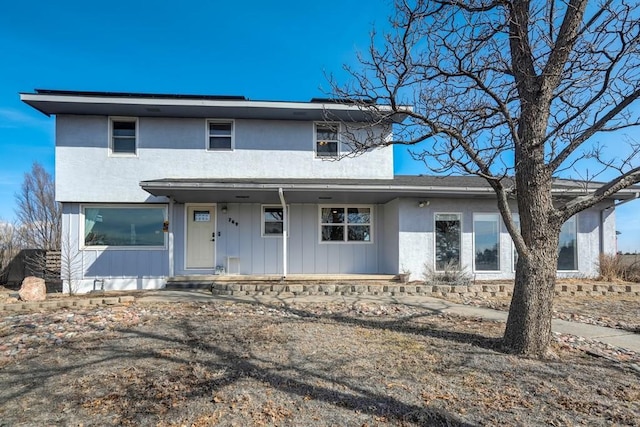 traditional-style home featuring stucco siding