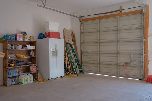 4131 County Rd 510, Walsenburg, CO 81055 - garage featuring white refrigerator with ice dispenser