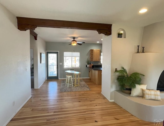 dining room with light wood-style flooring, baseboards, a ceiling fan, and recessed lighting