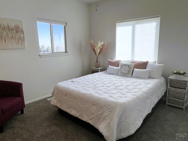 bedroom featuring carpet floors and baseboards