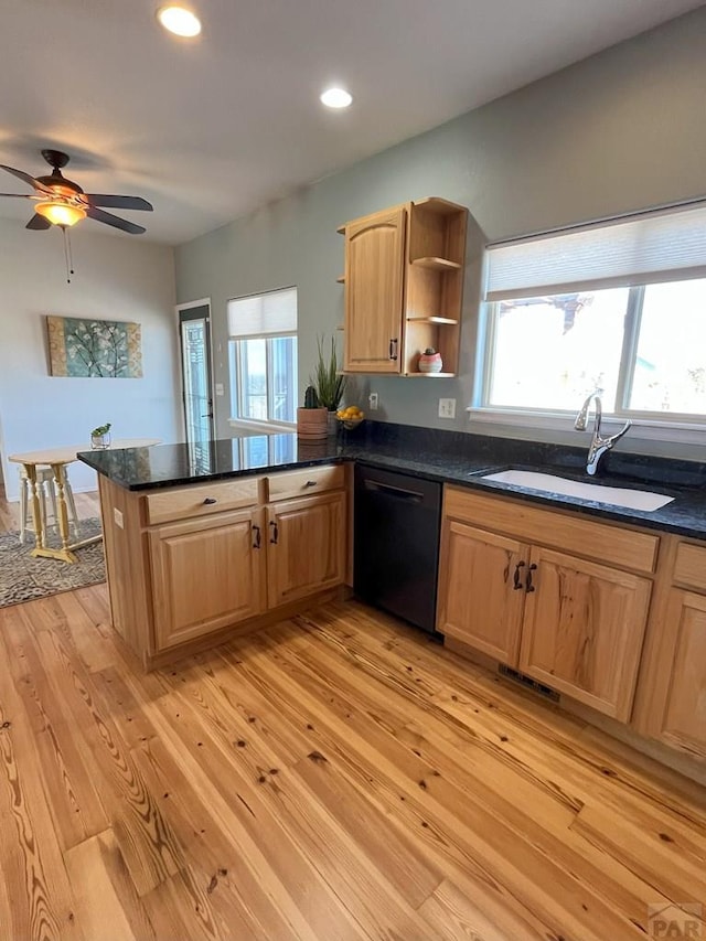 kitchen featuring black dishwasher, a peninsula, light wood-type flooring, open shelves, and a sink