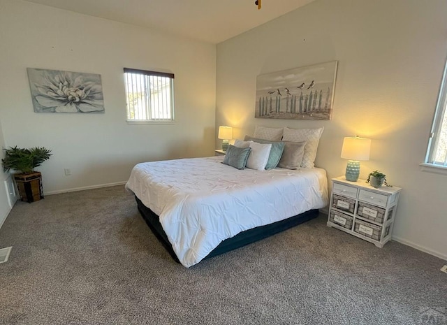 bedroom featuring carpet floors, visible vents, and baseboards