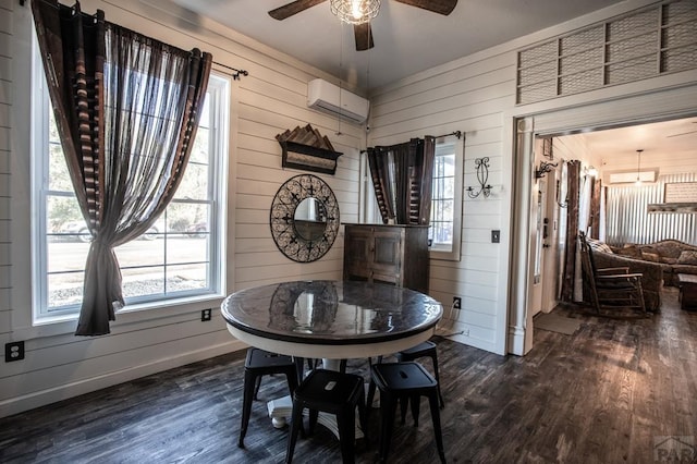 dining area featuring dark wood-type flooring, a ceiling fan, baseboards, and a wall mounted AC