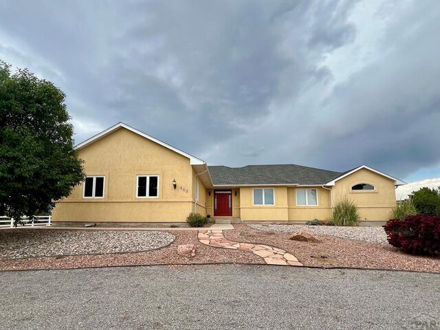 ranch-style home with stucco siding