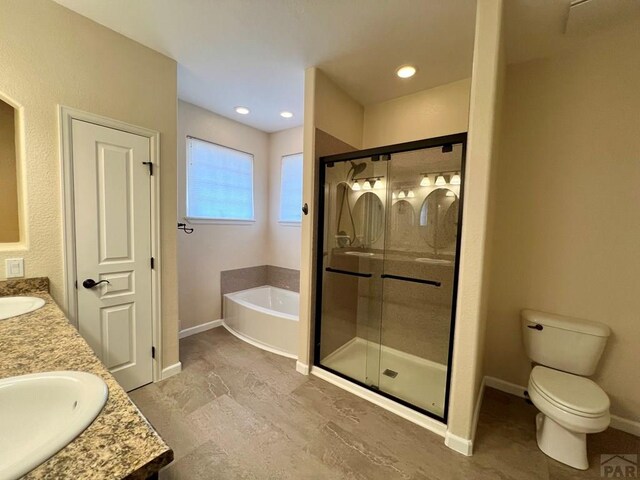 full bathroom with double vanity, toilet, a sink, a shower stall, and a bath