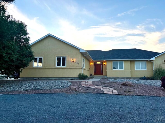 ranch-style house with stucco siding