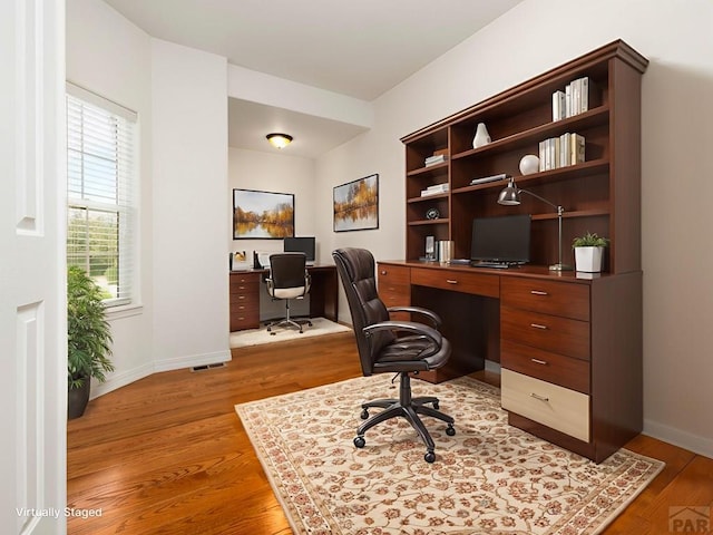 5522 Ventana Ct, Pueblo, CO 81005 - office space featuring light wood-style floors and built in study area