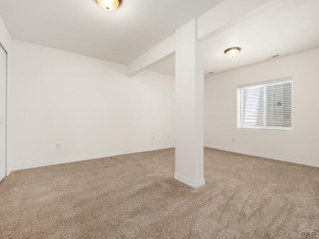 5522 Ventana Ct, Pueblo, CO 81005 - carpeted spare room featuring baseboards and beamed ceiling
