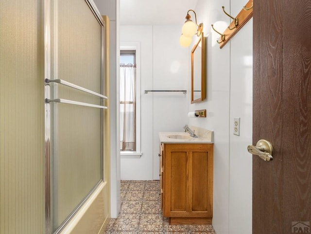215 E Pitkin Ave, Pueblo, CO 81004 - full bath with vanity, tile patterned flooring, and enclosed tub / shower combo