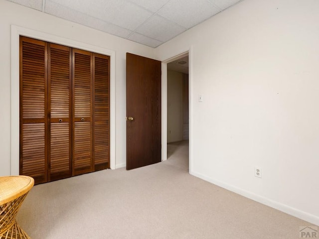 215 E Pitkin Ave, Pueblo, CO 81004 - unfurnished bedroom with carpet floors, a closet, and a drop ceiling