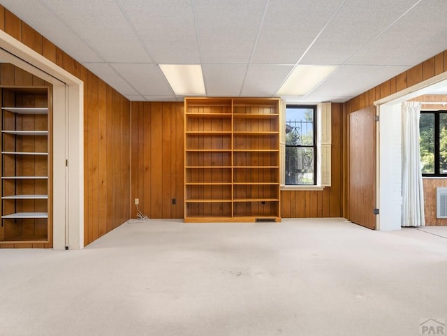 215 E Pitkin Ave, Pueblo, CO 81004 - carpeted empty room with wood walls