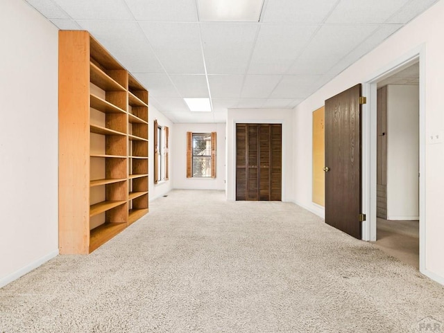 215 E Pitkin Ave, Pueblo, CO 81004 - below grade area with a drop ceiling and carpet flooring