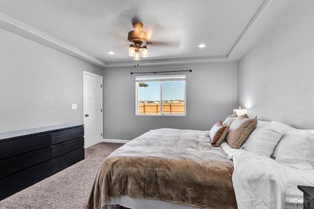 1207 N Jon Ln, Pueblo West, CO 81007 - bedroom with carpet floors, a raised ceiling, ceiling fan, and recessed lighting