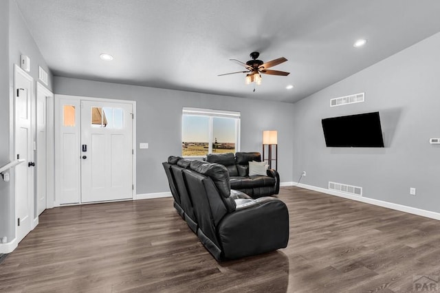 1207 N Jon Ln, Pueblo West, CO 81007 - living area featuring a ceiling fan, dark wood-type flooring, vaulted ceiling, and recessed lighting