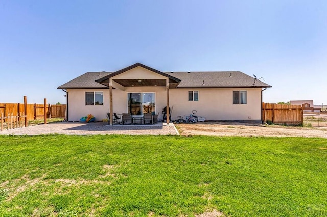 1207 N Jon Ln, Pueblo West, CO 81007 - rear view of property with a patio, a fenced backyard, and stucco siding