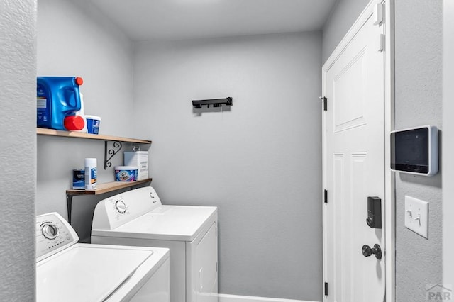 1207 N Jon Ln, Pueblo West, CO 81007 - washroom with washing machine and clothes dryer and baseboards