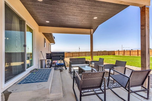 1207 N Jon Ln, Pueblo West, CO 81007 - fenced backyard featuring outdoor lounge area and a patio area
