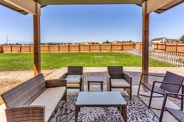 1207 N Jon Ln, Pueblo West, CO 81007 - fenced backyard featuring a patio area and an outdoor living space