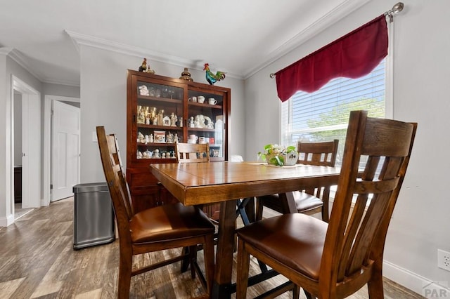 999 Fortino Blvd Unit 237, Pueblo, CO 81008 - dining space featuring ornamental molding, wood finished floors, and baseboards
