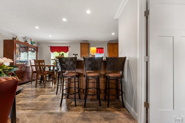 999 Fortino Blvd Unit 237, Pueblo, CO 81008 - bar area featuring ornamental molding, recessed lighting, and baseboards