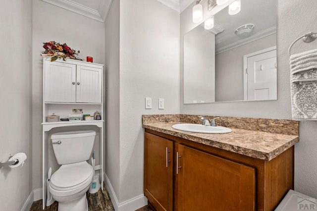 999 Fortino Blvd Unit 237, Pueblo, CO 81008 - bathroom with crown molding, toilet, baseboards, and vanity