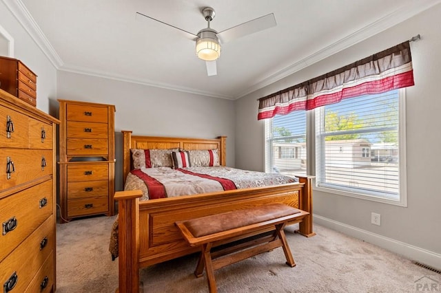 999 Fortino Blvd Unit 237, Pueblo, CO 81008 - bedroom with crown molding, light colored carpet, baseboards, and ceiling fan