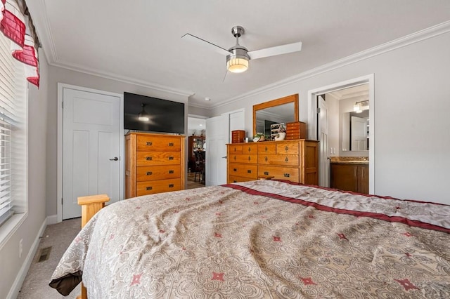 999 Fortino Blvd Unit 237, Pueblo, CO 81008 - carpeted bedroom with ornamental molding, baseboards, ensuite bathroom, and a ceiling fan