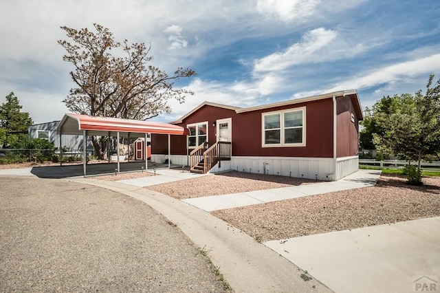 999 Fortino Blvd Unit 237, Pueblo, CO 81008 - manufactured / mobile home with a carport and fence