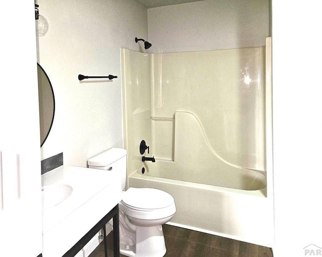 326 W Golden Eagle Way Unit 328, Pueblo West, CO 81007 - bathroom featuring wood finished floors, vanity, toilet, and washtub / shower combination