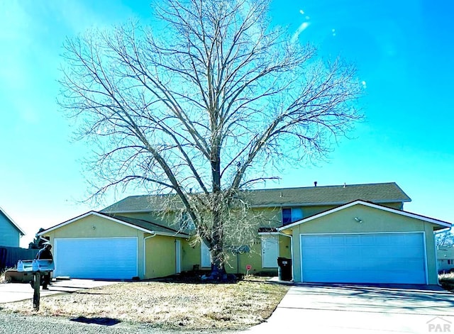 326 W Golden Eagle Way Unit 328, Pueblo West, CO 81007 - ranch-style house featuring stucco siding, an attached garage, and concrete driveway