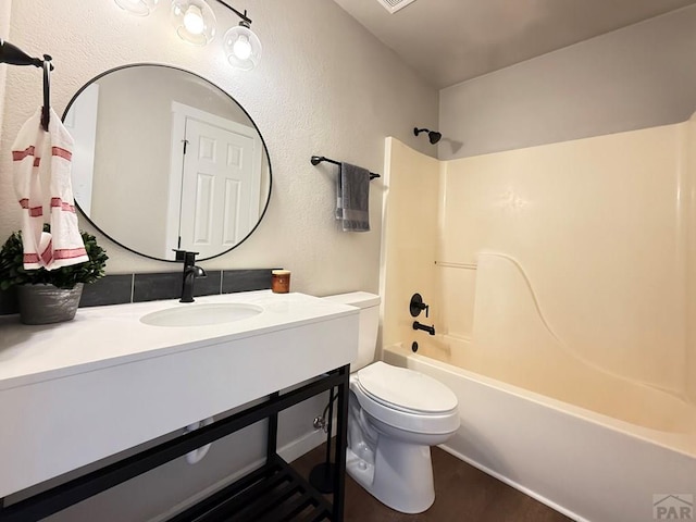 326 W Golden Eagle Way Unit 328, Pueblo West, CO 81007 - full bath with toilet, vanity, shower / tub combination, and a textured wall