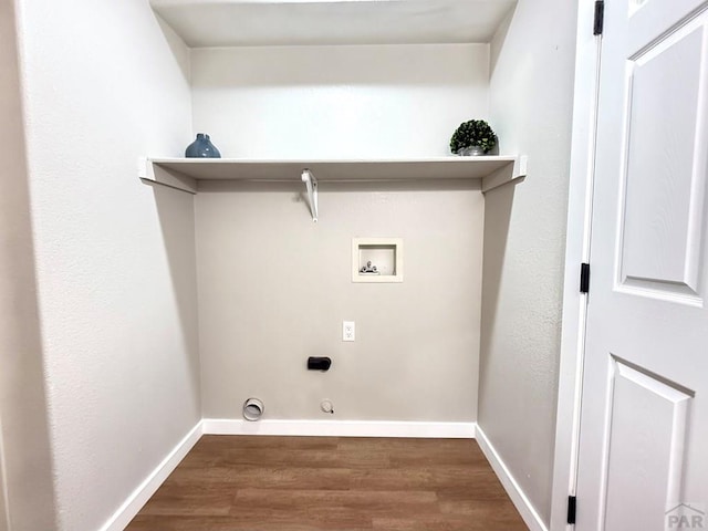 326 W Golden Eagle Way Unit 328, Pueblo West, CO 81007 - laundry area with washer hookup, wood finished floors, electric dryer hookup, and baseboards