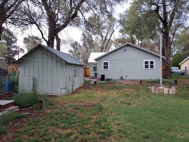 back of property featuring a yard