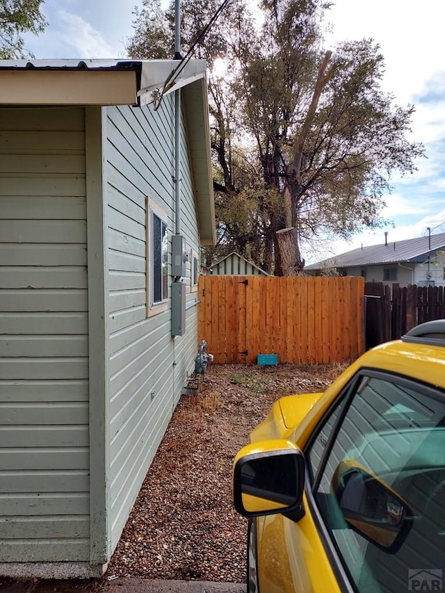 view of side of property with fence