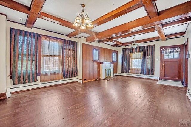 unfurnished living room featuring dark wood-style floors, a baseboard radiator, a baseboard heating unit, coffered ceiling, and baseboards