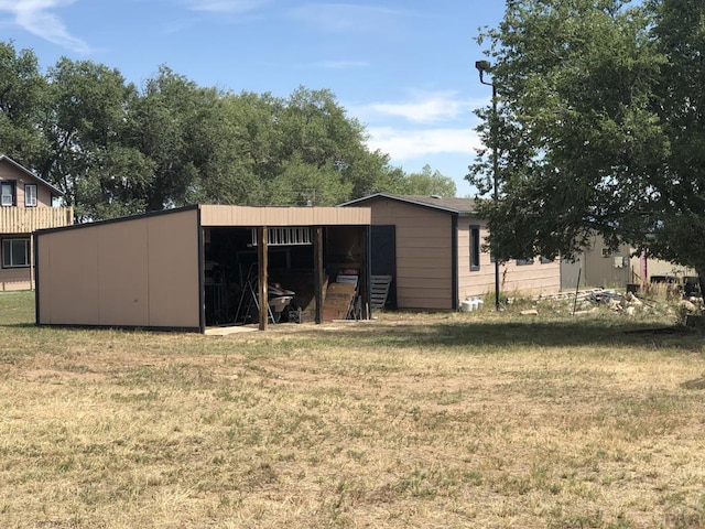 view of pole building with a lawn