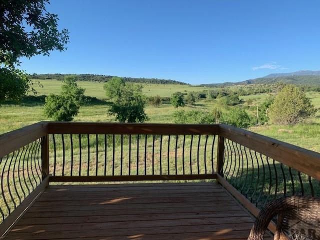 wooden deck featuring a rural view