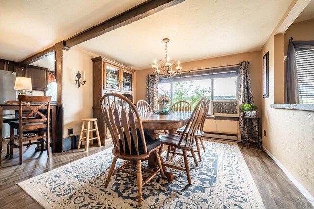 dining room featuring a notable chandelier, baseboards, dark wood-type flooring, and beamed ceiling